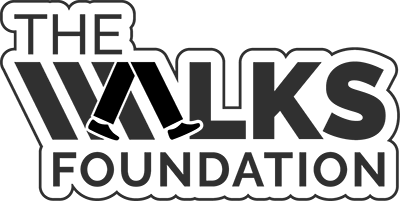 Walks Foundation - Black sans-serif type with walking legs icon as letter A in WALKS